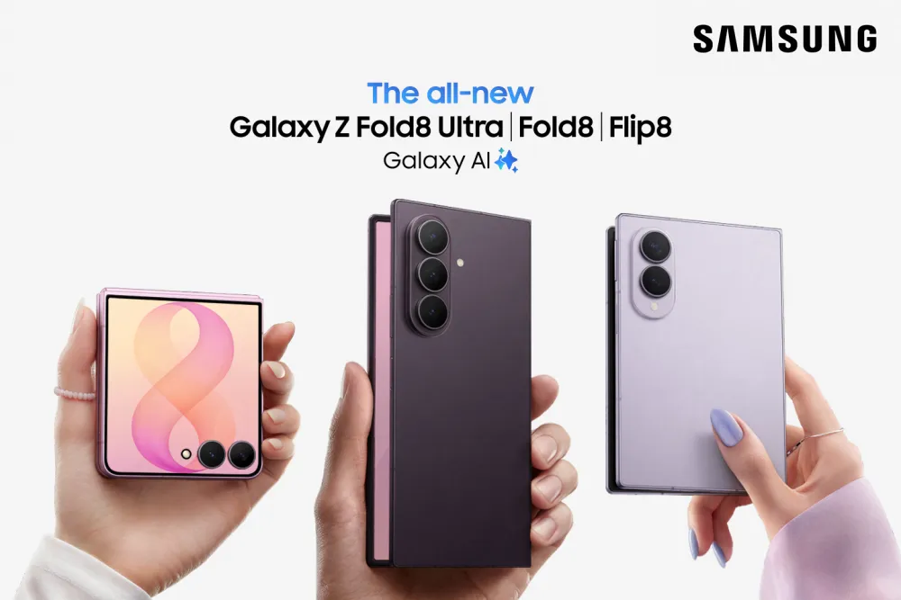Samsung's all-new Galaxy Z Fold8 Ultra, Fold8, and Flip8 held in three hands, the tall Fold8 Ultra in the middle and the shorter, wider Fold8 on the right.